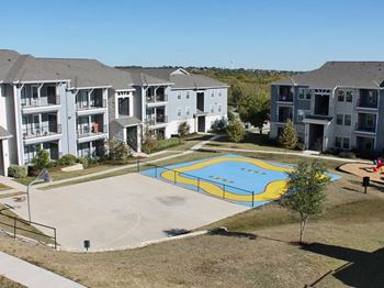 Sports court with basketball goal